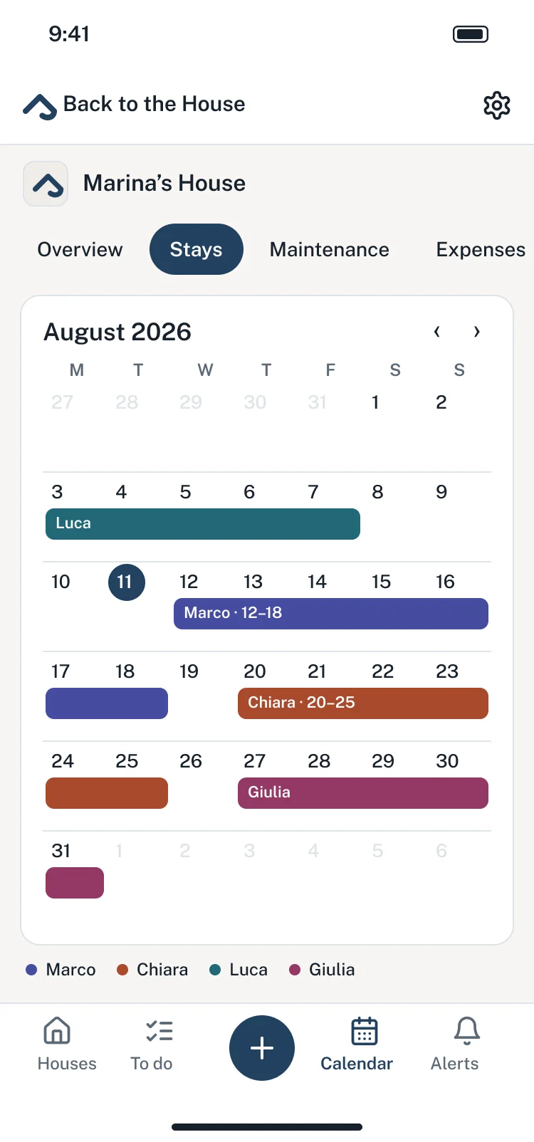 The August calendar in the app, with the stays of Marco, Chiara, Luca and Giulia in their colours.